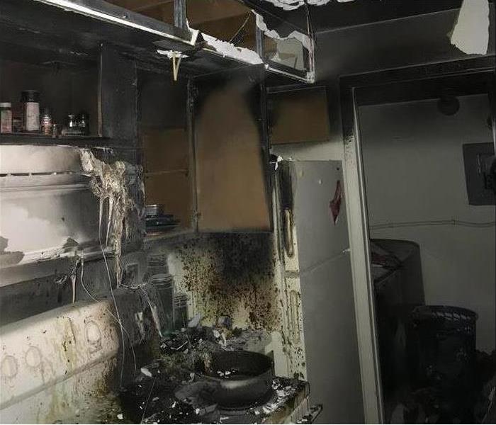 Kitchen damaged by a fire.