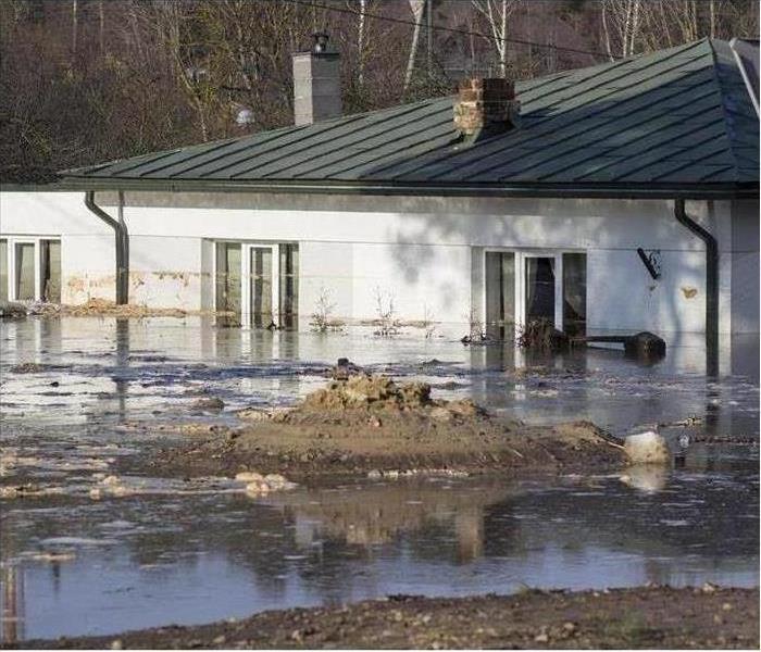 Image of a flooded home and surroundings