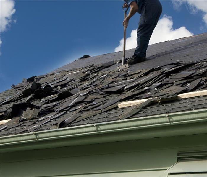 A professional making a roof replacement.
