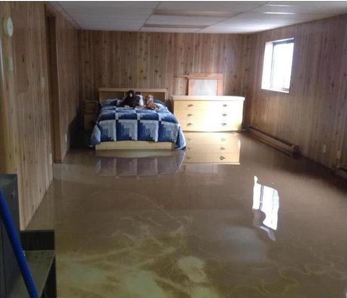 Basement floor flooded with dirty water. 