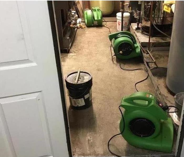 Image of drying equipment placed on floor after suffering flooding